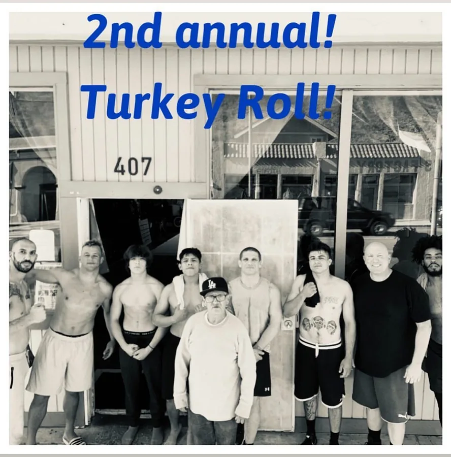 Group photo outside 407 N Ventura Ave for the gym's second annual Turkey Roll