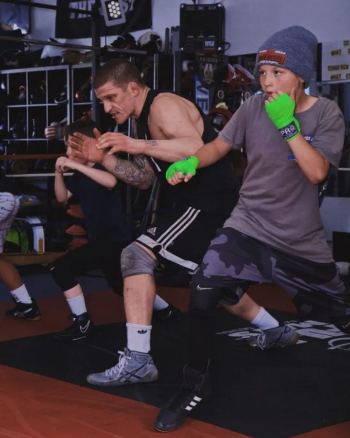 Two training partners working the clinch on the mat